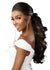 Black woman with long, wavy hair wearing sensationnel bare lace unit 8 wig styled into a half ponytail